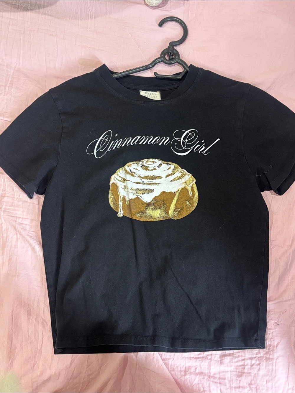 Cinnamon Girl Black Graphic Tee with Golden Roll Motif
